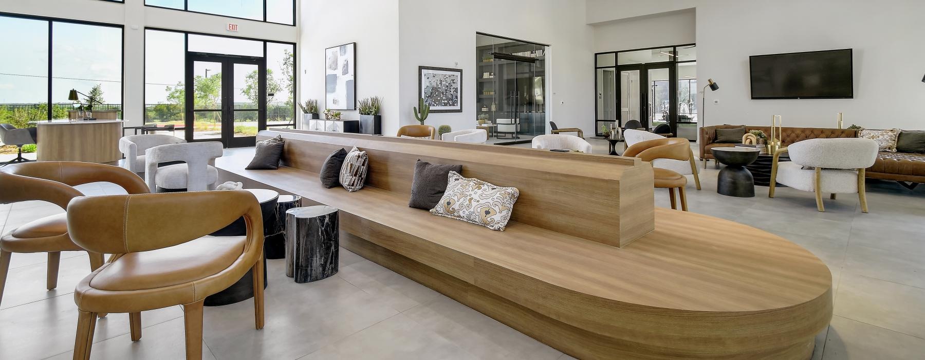 a large lounge area with wooden seating