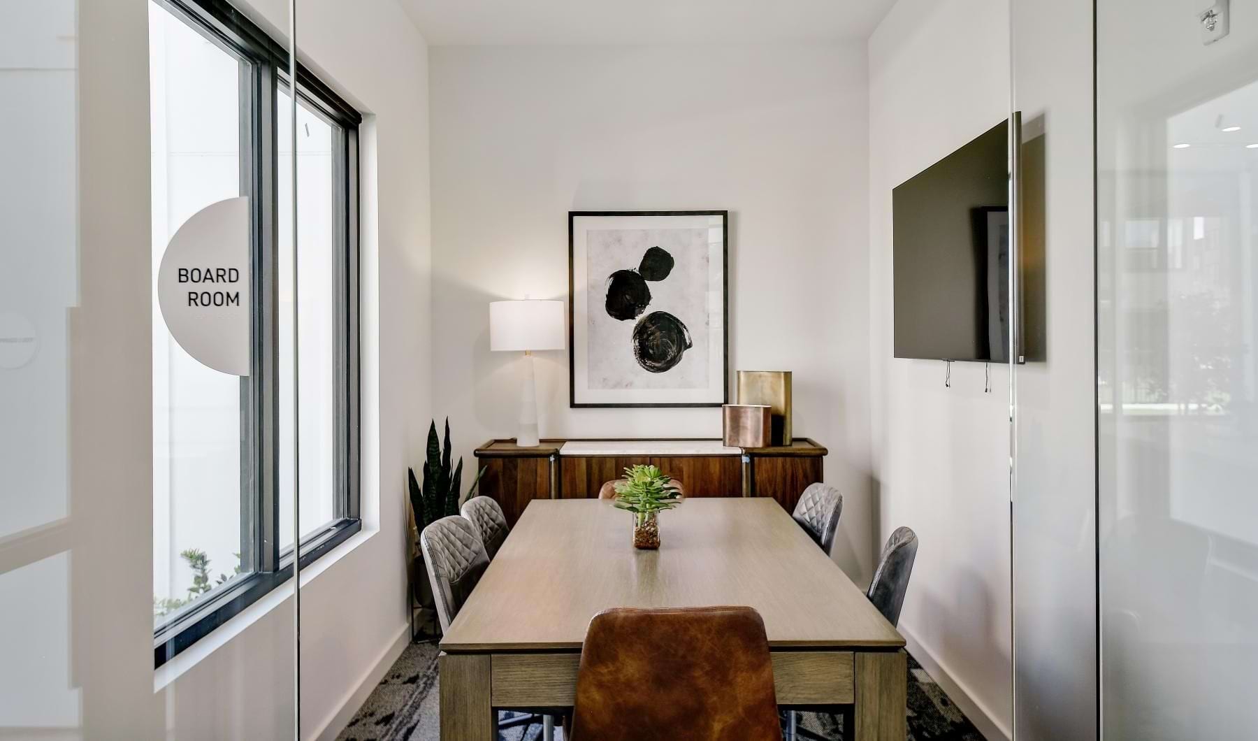 a dining room with a table and chairs